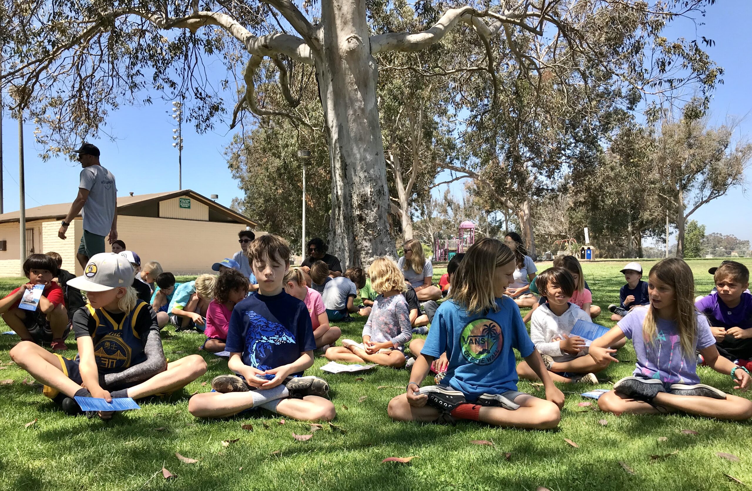 Morley Field Sports Complex in San Diego, 7/29/2019: Children are learning the Falun Dafa meditation exercise during summer camp.